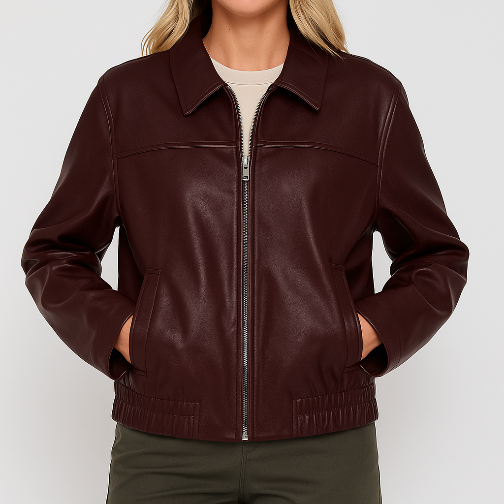 Faux leather jacket with zip-up front and collared neckline, styled in a relaxed modern fit