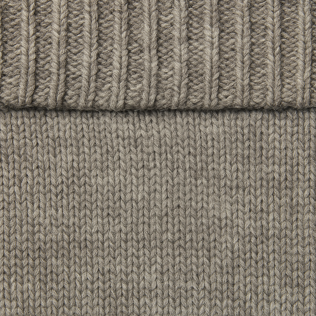 Knit off-shoulder sweater with ribbed fold-over neckline and relaxed fit, styled in a soft drape